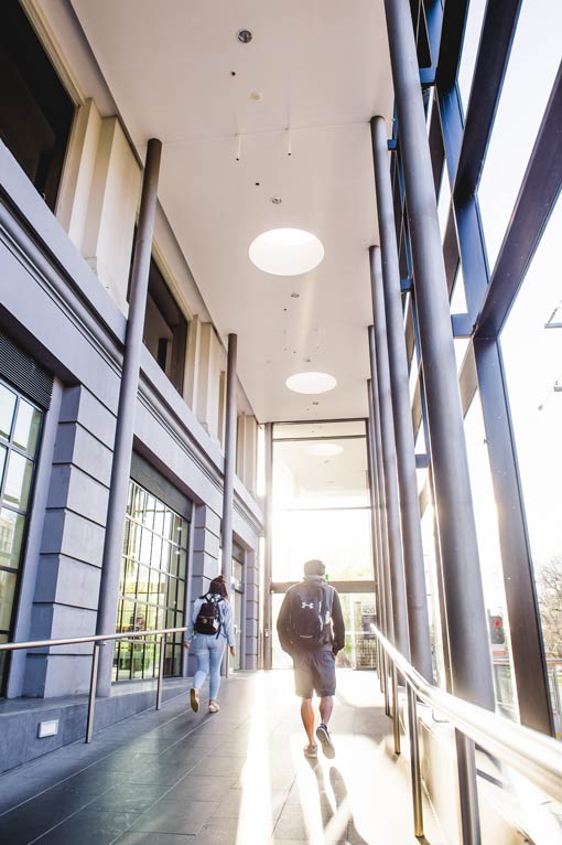 Students walk through the ACU Melbourne campus.